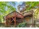 A back elevation features a multi-story wooden deck, perfect for outdoor entertaining at 2651 Briarlake Ne Rd, Atlanta, GA 30345