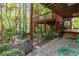 A backyard deck features a peaceful area for outdoor grilling and garden views at 2651 Briarlake Ne Rd, Atlanta, GA 30345