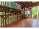 Multi-level wooden deck features a covered area for relaxing and enjoying the natural landscape at 2651 Briarlake Ne Rd, Atlanta, GA 30345