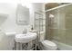 Clean bathroom with a vessel sink, storage, and a glass-enclosed shower at 2651 Briarlake Ne Rd, Atlanta, GA 30345