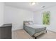 Neutral bedroom offering carpeted floors, white walls, and a queen bed with a window view at 2651 Briarlake Ne Rd, Atlanta, GA 30345