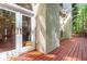 Side view of a house featuring a wood deck, accessible through elegant glass French doors at 2651 Briarlake Ne Rd, Atlanta, GA 30345