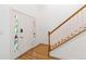 Inviting foyer with hardwood floors, featuring a decorative glass front door and staircase at 2651 Briarlake Ne Rd, Atlanta, GA 30345