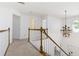 Upstairs landing with a view into the entry way, and multiple rooms nearby at 2651 Briarlake Ne Rd, Atlanta, GA 30345