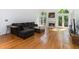 Spacious living room with a fireplace, hardwood floors, and arched windows at 2651 Briarlake Ne Rd, Atlanta, GA 30345