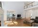 Bright living room with high ceilings, hardwood floors, and a view of the kitchen and dining area at 2651 Briarlake Ne Rd, Atlanta, GA 30345