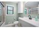 Bathroom with a shower-tub combo, updated vanity, and modern fixtures at 2738 Westchester Dr, Atlanta, GA 30344