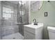 Modern bathroom with gray tiled walk-in shower, updated vanity, and stylish fixtures at 2738 Westchester Dr, Atlanta, GA 30344