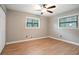 Bright bedroom with hardwood floors, closet, and two windows for ample natural light at 2738 Westchester Dr, Atlanta, GA 30344