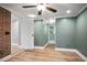 Bedroom with stylish color scheme features hardwood floors and bathroom access at 2738 Westchester Dr, Atlanta, GA 30344
