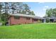 Lovely single story brick home with manicured lawn and landscaping featuring shuttered windows at 2738 Westchester Dr, Atlanta, GA 30344