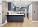 Modern kitchen features navy cabinets, stainless steel appliances, and white countertops at 2738 Westchester Dr, Atlanta, GA 30344