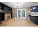 Stylish living space featuring a brick fireplace, sleek built-ins, and an open layout at 2738 Westchester Dr, Atlanta, GA 30344