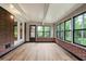 Bright sunroom with hardwood floors, large windows and brick accents at 2738 Westchester Dr, Atlanta, GA 30344