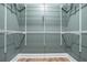 A walk-in closet with a custom organizing system and hardwood floors at 2738 Westchester Dr, Atlanta, GA 30344