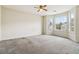 Bedroom includes carpeted floors, two windows, and neutral walls at 4129 Flakes Mill Manor Ln, Ellenwood, GA 30294