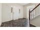 Foyer features a unique floor pattern, white door, and stairs at 4129 Flakes Mill Manor Ln, Ellenwood, GA 30294
