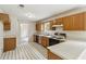 Kitchen featuring wooden cabinets, white countertops, black and white floors, and an oven at 4129 Flakes Mill Manor Ln, Ellenwood, GA 30294