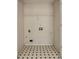 Laundry room featuring tiled floor, laundry hookups, and wire shelf at 4129 Flakes Mill Manor Ln, Ellenwood, GA 30294