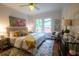 Comfortable bedroom with neutral tones, ceiling fan, and stylish decor at 959 Berne Se St, Atlanta, GA 30316