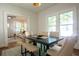 Bright dining area with modern table set adjacent to the living room, with connecting doorway at 959 Berne Se St, Atlanta, GA 30316