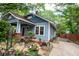 Attractive blue house with lush landscaping and a inviting front porch area at 959 Berne Se St, Atlanta, GA 30316