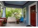 Cozy front porch with seating, a birdhouse, and a charming view of the landscaped yard at 959 Berne Se St, Atlanta, GA 30316