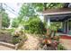 Beautiful front yard with lush landscaping, flowers, and a charming stone walkway leading to the porch at 959 Berne Se St, Atlanta, GA 30316
