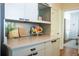Kitchen counter with light gray cabinets and open shelving at 959 Berne Se St, Atlanta, GA 30316