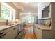 Bright kitchen with gray cabinets, stainless appliances, and breakfast nook at 959 Berne Se St, Atlanta, GA 30316