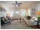 Bright living room with hardwood floors, fireplace, stylish decor, and plenty of natural light at 959 Berne Se St, Atlanta, GA 30316