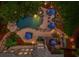 Aerial shot of a luxurious backyard featuring a custom pool, spa, and meticulously designed landscaping at 106 Stephens Farm Dr, Canton, GA 30115