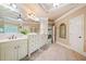 Large bathroom features a double vanity, a glass shower, and a tile floor at 106 Stephens Farm Dr, Canton, GA 30115