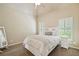 Serene bedroom featuring a neutral color scheme, white bed, and window with shutters at 106 Stephens Farm Dr, Canton, GA 30115