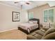 Comfortable bedroom featuring a plush bed, soft lighting, and a cozy seating area at 106 Stephens Farm Dr, Canton, GA 30115