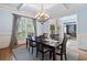Formal dining room boasts natural light, hardwood floors, and sophisticated decor at 106 Stephens Farm Dr, Canton, GA 30115