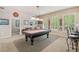 Fun game room with a pool table, bar stools and lots of natural light at 106 Stephens Farm Dr, Canton, GA 30115