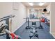 Well-equipped home gym with treadmills, weights, and a large mirror, perfect for maintaining an active lifestyle at 106 Stephens Farm Dr, Canton, GA 30115