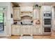 Gourmet kitchen with stainless steel appliances, custom cabinetry, and gas cooktop at 106 Stephens Farm Dr, Canton, GA 30115