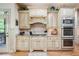 Charming kitchen featuring stainless steel appliances, custom cabinetry, and granite countertops at 106 Stephens Farm Dr, Canton, GA 30115