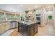Open-concept kitchen with granite countertops, island, and stainless steel appliances at 106 Stephens Farm Dr, Canton, GA 30115