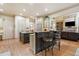Open kitchen and living room floorplan with barstool seating at the island at 106 Stephens Farm Dr, Canton, GA 30115
