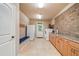 Bright laundry room with modern appliances, ample counter space, and convenient storage options at 106 Stephens Farm Dr, Canton, GA 30115