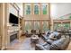 Spacious living room with fireplace, built-in shelving, and abundant natural light at 106 Stephens Farm Dr, Canton, GA 30115