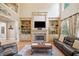 Inviting living room features a cozy fireplace and custom built-in shelves at 106 Stephens Farm Dr, Canton, GA 30115