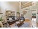 Open-concept living room leading into kitchen and featuring staircase to the second floor at 106 Stephens Farm Dr, Canton, GA 30115