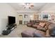 Spacious living room with large leather sofa and entertainment center, providing a relaxing and open living space at 106 Stephens Farm Dr, Canton, GA 30115
