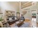 Open living area with staircase access to a second story and partial view to kitchen at 106 Stephens Farm Dr, Canton, GA 30115