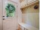 Mud room featuring built-in storage, a bench, and a door with a decorative wreath at 106 Stephens Farm Dr, Canton, GA 30115