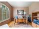 Well-lit office featuring hardwood floors, shuttered window, and sophisticated decor at 106 Stephens Farm Dr, Canton, GA 30115